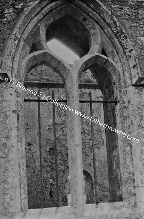 CLARE ABBEY   WINDOW IN NORTH WALL WITH MONKS HEAD